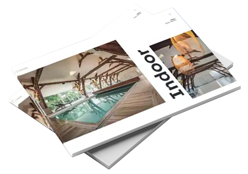 catalogue Catalogue avec couverture montrant une piscine intérieure entourée de poutres en bois, avec le mot "Indoor" visible en noir.